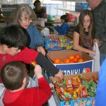 Volunteers pack food bags